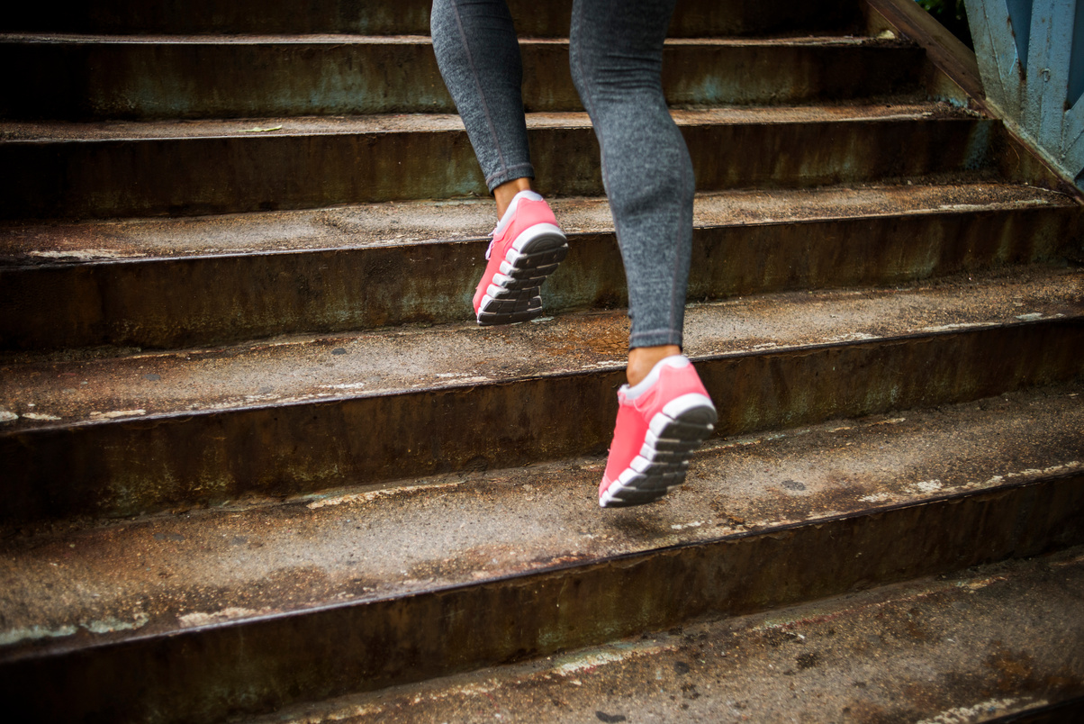 Girl running up stairs